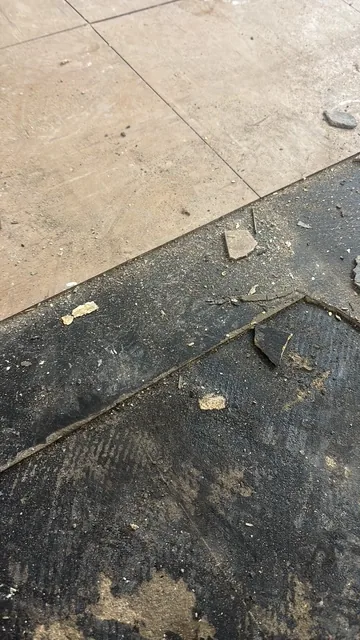 Black bitumen mastic floor removal in a SE26 flat